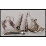 A collection of 4 sets of earrings.