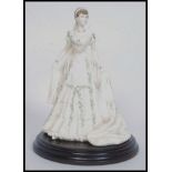 An original Coalport Compton & Woodhouse Limited Edition Queen Mary figurine.