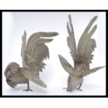 A pair of 20th century large white metal fighting cocks ornaments ( see illustrations ) H24cm