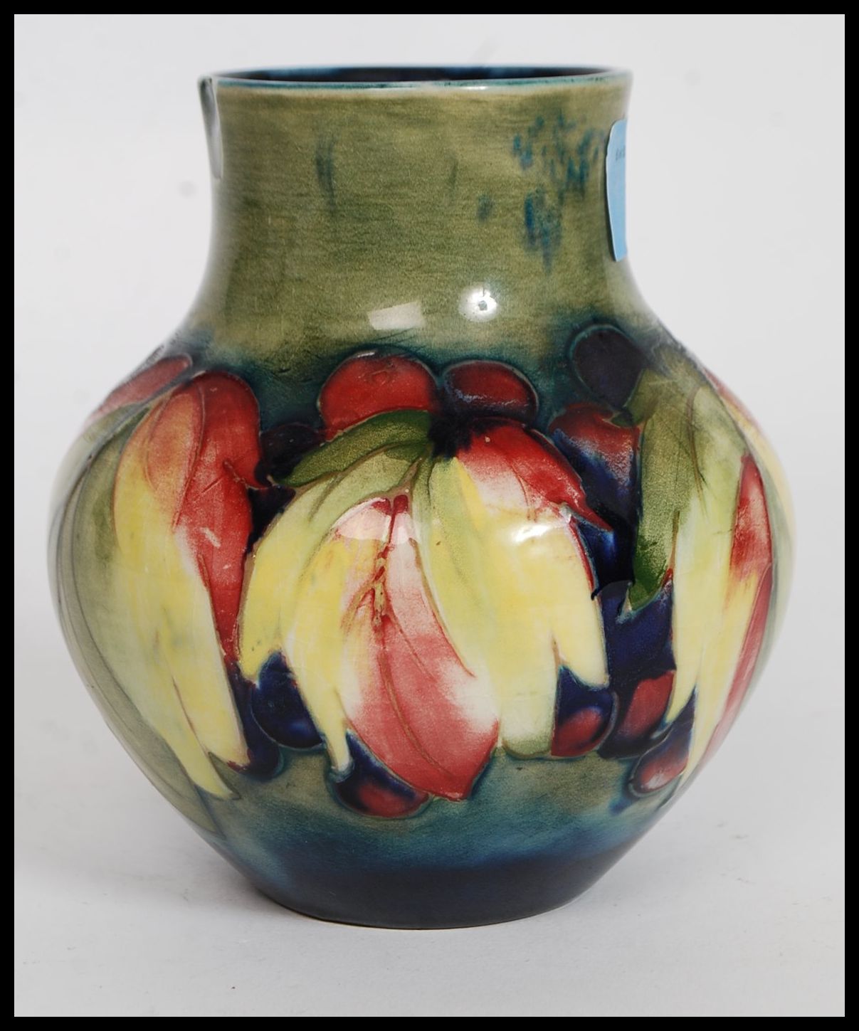 A 1930's  ( c1928-1949 ) William Moorcroft tubeline baluster vase in the  berry and leaf pattern - Image 5 of 6