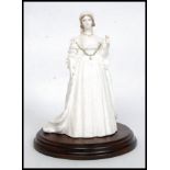 An original Coalport Compton & Woodhouse Limited Edition Queen Victoria figurine.