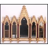 An two toned painted shabby chic and parcel gilt Gothic revival style compartment overmantel wall
