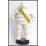 MICHELIN MAN: A 15" (approx) cast iron advertising figure of Bibendum, the Michelin tyres mascot.