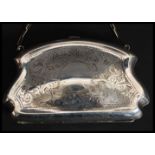 A silver plated ladies evening purse having hinged top,