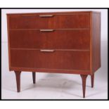 A good retro 1970's teak chest of drawers raised on tapered supports with blind front drawers.