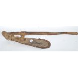 A Polynesian Adze of hardwood form - Primitive tool bound with a basket weave with cast iron