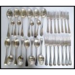 A Victorian extensive silver hallmarked cutlery set. Comprising forks, table spoons, teaspoons etc.