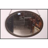 A 20th century brass surround wall mirror having a bevelled mirror panel.