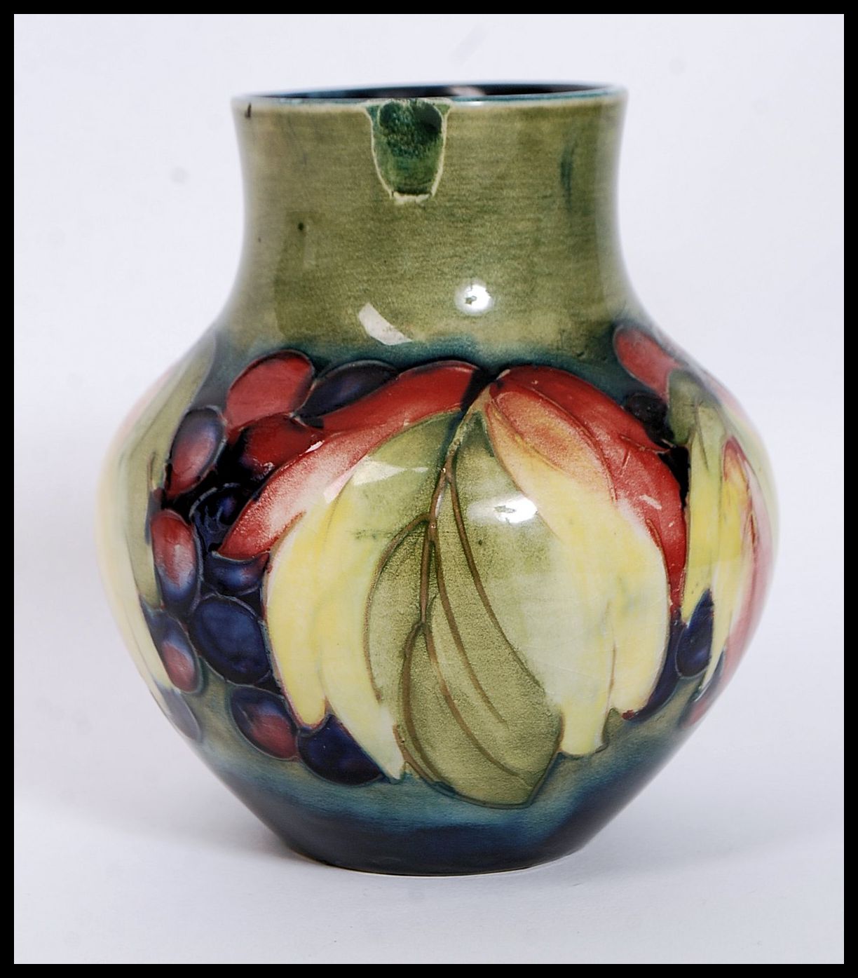 A 1930's  ( c1928-1949 ) William Moorcroft tubeline baluster vase in the  berry and leaf pattern - Image 2 of 6