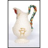 A large Clarice Cliff Celtic Harvest pattern jug of footed baluster form relief moulded with corn,