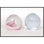 A later 20th Century Caithness paperweight titled Pink Champagne having an internal powder pink and