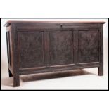 An early 19th century  large carved country oak coffer chest / blanket box.