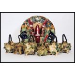 A collection of Majolica to include a Lobster and sealife decorated dish and a collection of