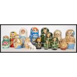 A collection of 20th century Russian made graduating wooden dolls, each fitting inside another,