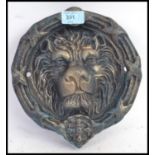 A Victorian style cast iron large door knocker, in the form of a lions head.