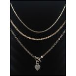 3 silver necklace chains, one with bar link and heart pendant.