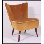 A vintage / retro 1950's cocktail chair - lounge chair in original yellow velour material being