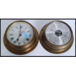 A contemporary vintage style brass effect bulkhead barometer together with matching quartz clock.