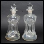 A pair of vintage Holmegaard Kluk Kluk clear glass decanters complete with crown / king top