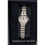 A Caravelle by Bulova ladies wristwatch with white dial set on stainless steel bracelet complete in
