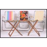 A collection of seven ( 7 ) vintage / retro folding metal framed and canvas camping chairs and