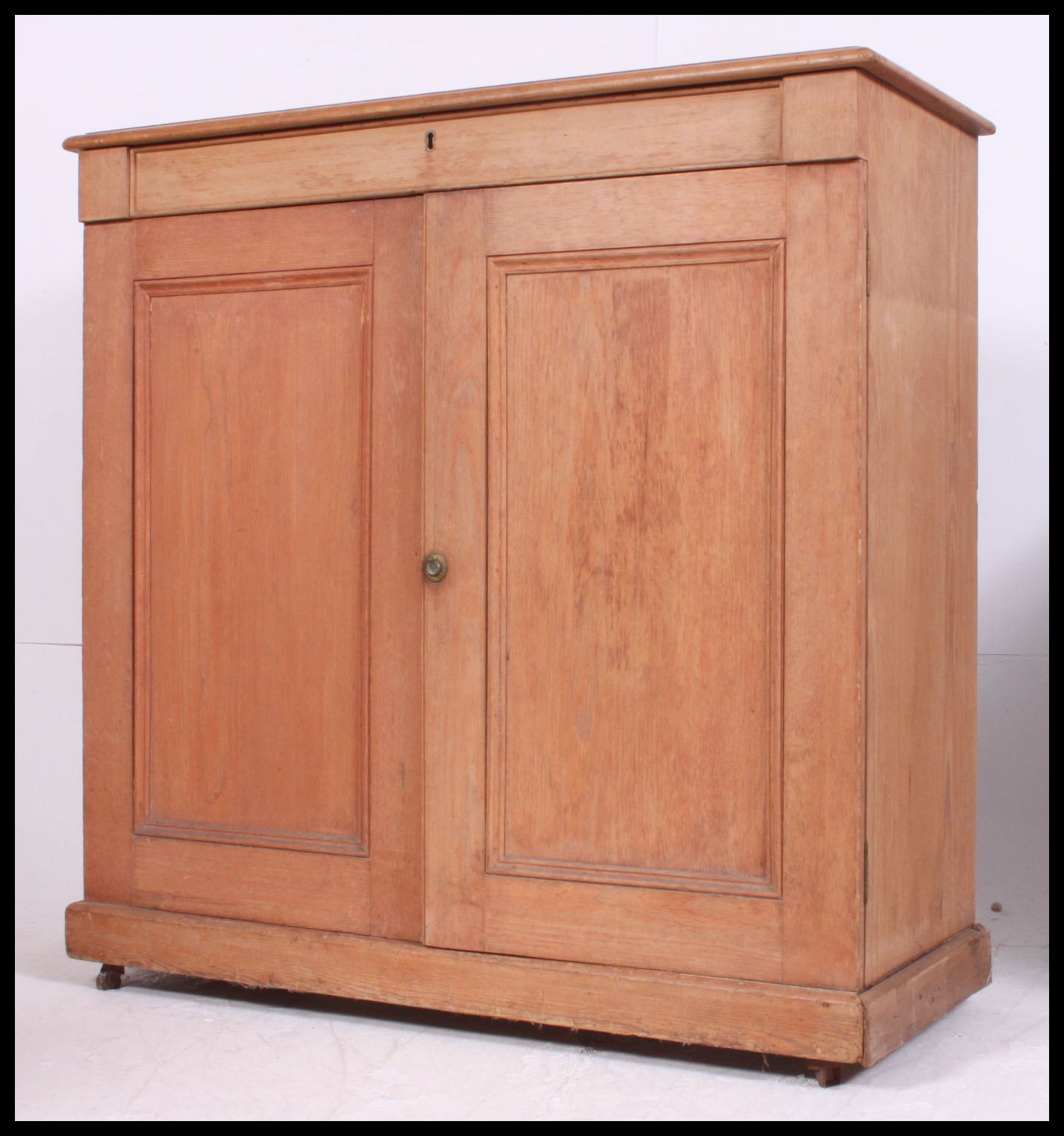 A Victorian pine school cupboard.