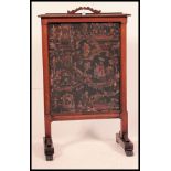 A 19th century Victorian mahogany firescreen. Raised on shaped legs with a central tapestry screen.