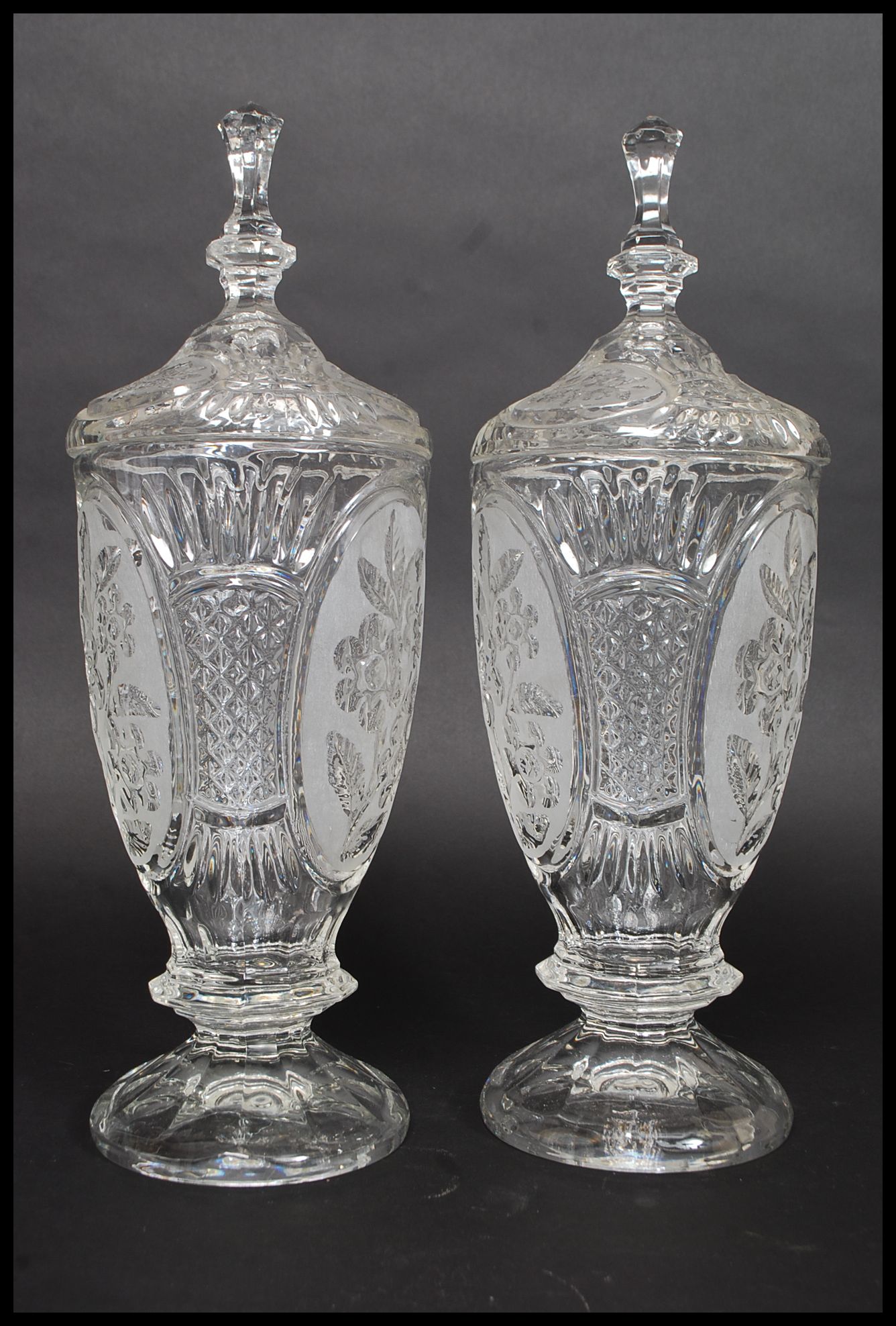 A pair of 20th century cut glass tall biscuit barrels, each to lids having finials tops. - Image 2 of 4