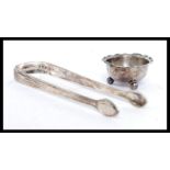 A pair of Georgian 19th century silver hallmarked sugar tongs by Peter, Ann & William Bateman mark,