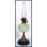 A Victorian high Art Nouveau green glass, gilt metal and ceramic oil lamp. Complete with flue.