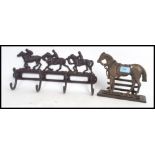 HORSE ITEMS: Two cast metal horse themed racks - one being a coat rack, the other a letter rack.