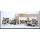 A collection of assorted loose unboxed Lilliput Lane model cottages,