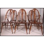 An excellent set of 6  Golden Dawn Ercol refectory dining chairs raised on turned supports united