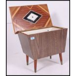 A fantastic retro sewing / work box having a vaneered outer with a lift up lid exposing a fantastic