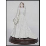 An original Coalport Compton & Woodhouse Limited Edition The Queen CW130 figurine.