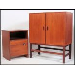 A 1970's Danish influence teak cabinet on stand in the manner of G-Plan.