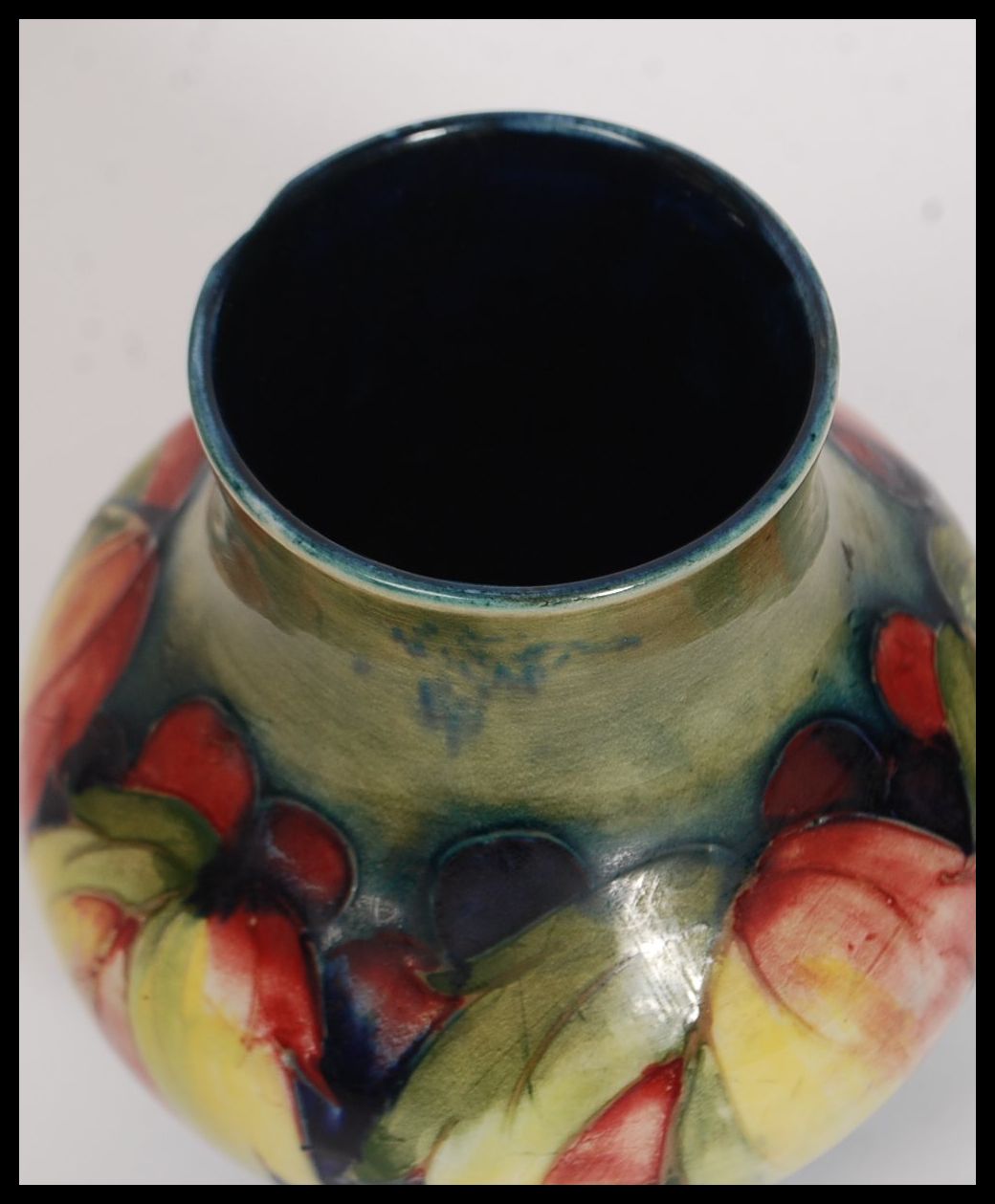 A 1930's  ( c1928-1949 ) William Moorcroft tubeline baluster vase in the  berry and leaf pattern - Image 3 of 6