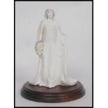 An original Coalport Compton & Woodhouse Limited Edition Queen Elizabeth figurine.