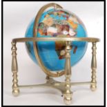 A hardstone A Lapis Lazuli inlaid brass desk top / library revolving globe in gimballed brass frame.