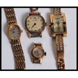 A collection of ladies dress watches being yellow gold to also include one with a 9ct gold strap /