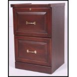 A late 20th century mahogany veneer two drawer office filing cabinet,