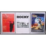 A collection of 3 film posters in aluminium frames.