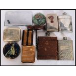 A collection of silver plated items to include a cigarette case, hip flasks etc.