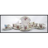 A 20th century Czech lusterware tea service to include cups,