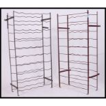 A pair of vintage folding / metamorphic metal work wine racks,