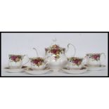 A Royal Albert Old Country Roses tea service comprising teapot, cups, saucers,