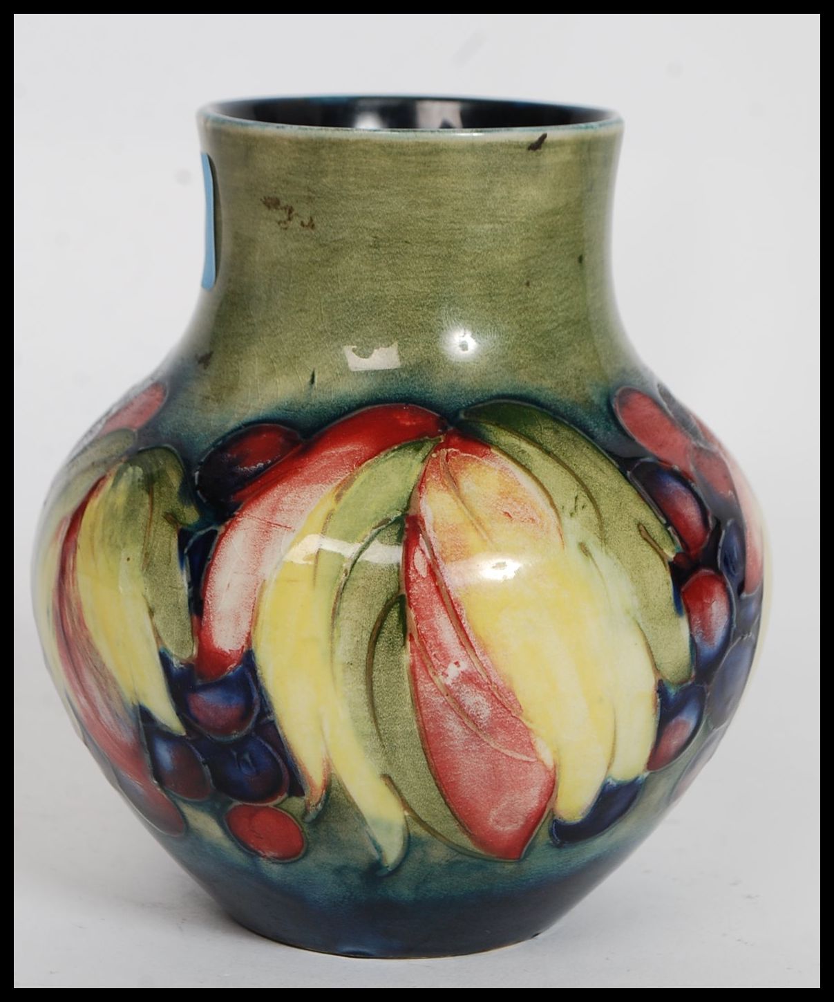 A 1930's  ( c1928-1949 ) William Moorcroft tubeline baluster vase in the  berry and leaf pattern - Image 6 of 6