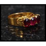 A stunning 22ct gold ( high carat ) 3 stone ruby ring.