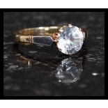 An early 20th century 9ct gold and platinum ring with large cushion cut white sapphire ? stone