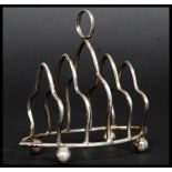 A hallmarked for Birmingham silver toast rack by G F Westwood & Sons having a date letter A